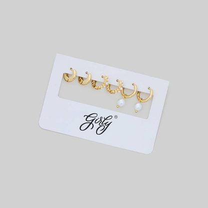 THREE PAIRS OF PEARL AND BRASS HUGGIES