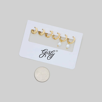 THREE PAIRS OF PEARL AND BRASS HUGGIES