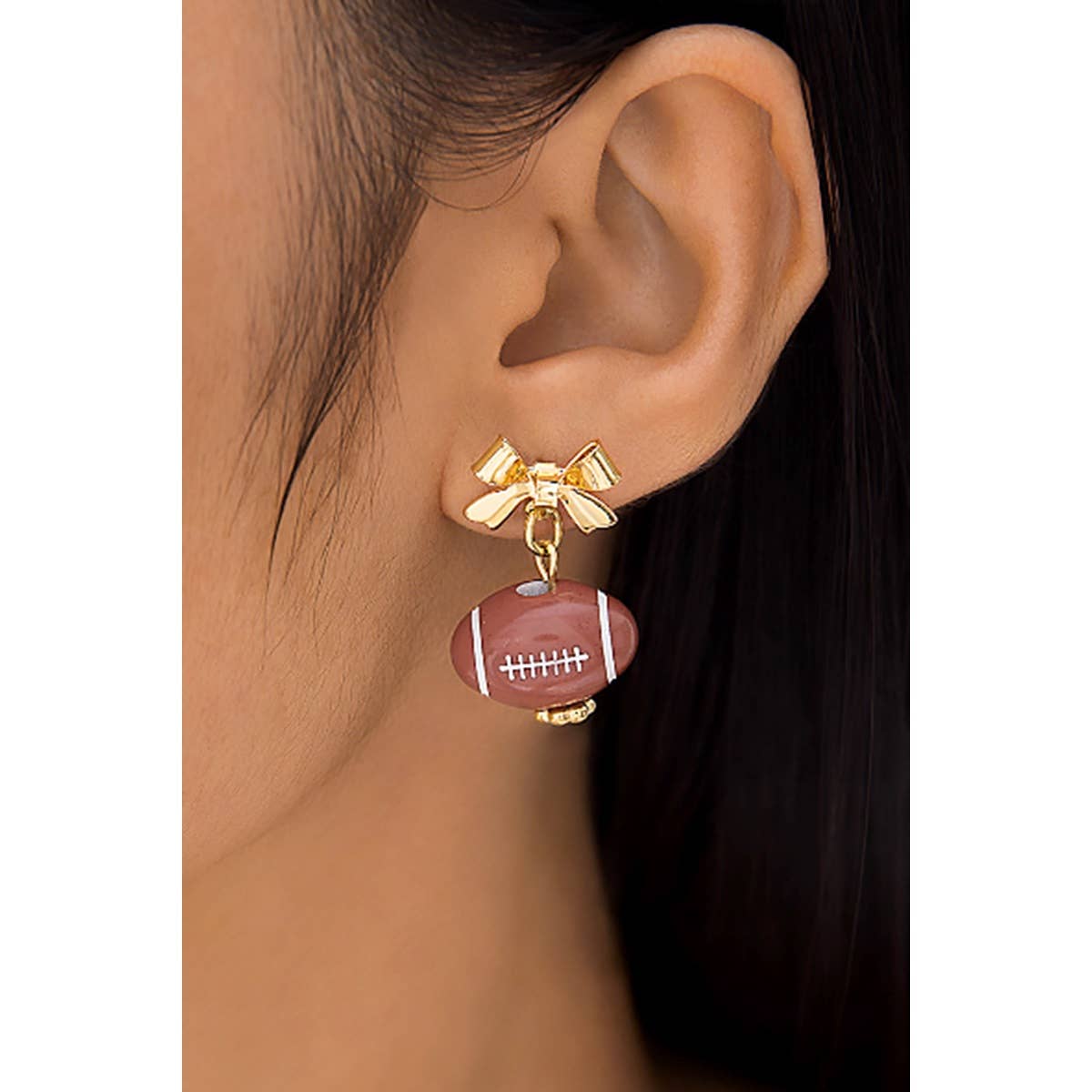 LOVELY BOW POST EARRINGS WITH DANGLING FOOTBALL: Brown / ONE SIZE